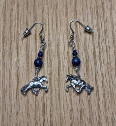 "Friesian Trot Horse Earrings Solid Sterling Silver 925 and Genuine Natural Lapis Lazuli Sterling silver findings may vary by availability. The Gemstones will always vary each one is unique. Pictured is Lapis Lazuli - Gemstones such as onyx, and amethyst, coral and crystals and more are also available. These horse earrings are about 1 1/2\" length. They are from a line of personally hand carved and cast horse jewelry. They are the left and right side of a trotting horse. Light weight for comfort Equine Jewelry, Horse Earrings, Lapis Earrings, Silver Horse, Horse Necklace, Horse Jewelry, Valentines Necklace, Valentines Jewelry, Sterling Earrings