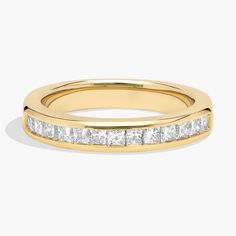 a yellow gold wedding band with princess cut diamonds