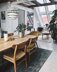 the instagram page shows an image of a dining room table with chairs and plants