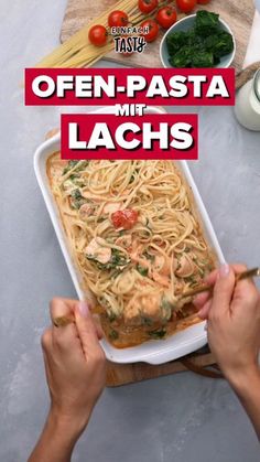 a person holding a fork over a dish of pasta