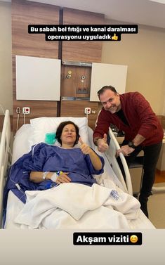 a man standing next to a woman in a hospital bed