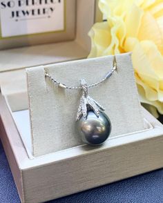 "Jewelry is the one thing that has the power to make you feel absolutely unique and elegant. Dazzle yourself and everyone around you with this cute and lustrous Tahiti, South Sea Pearl pendant. Featuring a RARE, LUSTROUS 14 mm Natural, Round, White South Sea Pearl, accented by 35 pieces of Brilliant Round diamonds weighing at 0.40 carat. Set in 18K solid white gold, handcrafted by professional goldsmith. All gems have been selected and graded for their unsurpassed quality and authenticity. ONE O Elegant Tahitian Pearl Drop Necklace, Tahitian Pearl Necklace With Pearl Pendant For Anniversary, Fine Jewelry Tahitian Pearl Pendant Necklace, Fine Jewelry Tahitian Pearl Pendant, Tahitian Pearl Pendant Necklaces For Formal Occasions, Tahitian Pearl Pendant Round Necklaces, Tahitian Pearl Pendant Jewelry, Tahitian Pearl Pendant Necklace, Formal Tahitian Pearl Pendant Necklaces