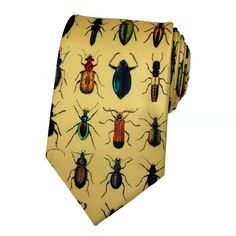 Crafted with meticulous attention to detail, this charming accessory features a delightful array of vibrantly hued insects intricately woven into a luxurious gold background. Whether you're adding a playful twist to your formal attire or looking to make a statement at a special event, this exquisitely designed tie is sure to capture attention and spark conversation. Made from premium materials, it offers both style and durability, ensuring you stand out from the crowd with timeless elegance and Funky Ties, Bug Fashion, Silly Clothes, Fun Tie, Funky Outfits, Cool Ties, Gold Background, Friends Are Like, Colorful Socks