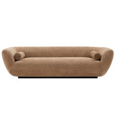 a brown couch sitting on top of a white floor