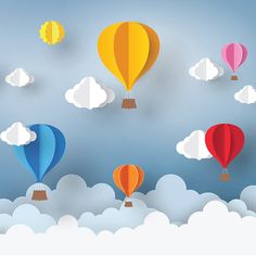 colorful hot air balloons floating in the sky with clouds around them on a sunny day