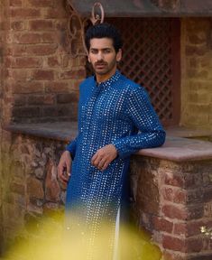 The umaid kurta is a stunning electric blue kurta made from viscose cotton silk, ideal for Indian grooms attending haldi, mehndi, or sangeet ceremonies. The kurta features intricate machine-embroidered mirror work all over, creating a dazzling effect that catches the light and adds a festive sparkle. It comes with a white salwar and stole. Mirror Embroidery, Blue Kurta, Salwar Pattern, Indian Groom, Embroidered Border, Luxury Sale, Bespoke Tailoring, Mirror Work, Modern Bride