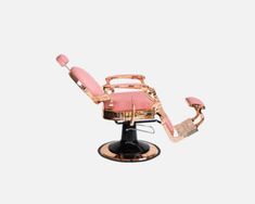 a pink and gold reclining chair sitting on top of a black pedestal with wheels