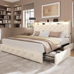 a bedroom with a bed, desk and bookcases