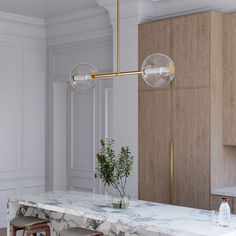 a kitchen with marble counter tops and stools