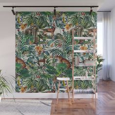 an animal themed wall mural in a living room