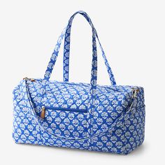 {"For quick weekend jaunts or adventures farther afield, hit the road (or friendly skies) with our chic, quilted duffel bag. Nice and roomy, it comes in fun original prints and is outfitted with an adjustable shoulder strap, two handles, inner and outer pockets, and leather trim; zip top. Complete the look with our matching tote and cosmetics bags, sold separately. Quilted duffel bag 100% cotton, with foam fill Great for travel, the roomy bag is patterned in your choice of exclusive prints Featu Duffel Bag Aesthetic, Quilted Duffle Bag, Camp Packing, Cute Luggage, Dream Bags, Cosmetic Bag Set, Ibiza Fashion, The Company Store, Duffle Bags