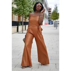 This Item Is New With Tags! Brownish Orange Color, Pu, Strapless, Belted, High Waist, Wide Leg. Large Pit To Pit: 17.5" Across The Waist: 16" Inseam: 27" Chic Brown Jumpsuits And Rompers For Summer, Chic Orange Jumpsuits And Rompers For Beach, Chic Orange Beach Jumpsuits And Rompers, Spring Strapless Jumpsuit For Work, Wide Leg Strapless Jumpsuit For Day Out, Chic Orange Jumpsuits And Rompers For Party, Chic Orange Jumpsuit For Night Out, Elegant Brown Jumpsuits And Rompers For Summer, Elegant Brown Summer Jumpsuits And Rompers