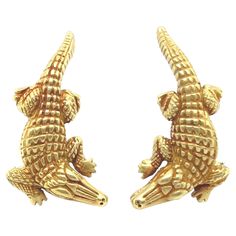 Eye-catching pair of 18 karat yellow gold alligator earrings by Kieselstein-Cord, 1988. Crafted in 18 karat yellow gold and designed to be worn up the lobe, these fabulous alligator earrings are completed by omega clip backs and fine studs provide additional security. The iconic alligator series by Barry Kieselstein-Cord were first introduced towards the end of the 1980s. All jewels from this collection are characterized by a distinctive greenish yellow gold alloy and smooth matte finish. These Alligator Earrings, Fine Studs, Gold Alloys, The 1980s, Jewelry Earrings Studs, Alligator, Clip On Earrings, The End, Porter