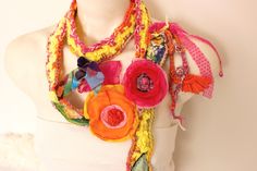 "Orange Hippie necklace, Colorful Crochet Scarf, Textile art pendant, Flowers Boho Scarf, Unique Scarf, Orange Flower, Women Hallowen gift Pink flowers, handmade leaves. It's an improvised work. It is made of recycled fabrics. I love this kind of job. Yours. The scarf is handmade. Leaves and handmade like crochet and flower cycle. chiffon fabric ornament. Unique product. I can easily tell you the gift options. My shop is not a repeat of crochet knit products. you will only be when you buy it. It Multicolor Necklaces With Handmade Flowers For Gift, Whimsical Multicolor Flower Necklace, Flower Cycle, Fabric Ornament, Unique Scarf, Boho Scarf, Flower Women, Colorful Crochet, Boho Scarfs