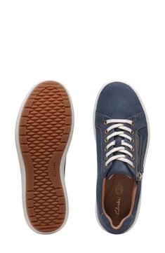 An easy-access side zip and tonal stitching adds modern touches to a sporty leather sneaker cushioned with a contoured footbed and breathable lining. Leather upper and lining/rubber sole Imported Sporty Leather Sneakers With Zipper Closure, Leather Sneakers, Easy Access, Side Zip, Womens Sneakers, Rubber Sole, Leather Upper, Stitching, Size 7