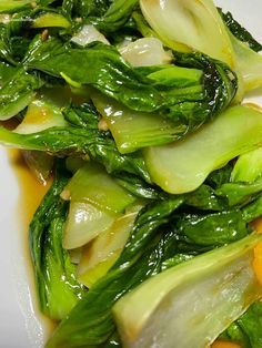 stir fried vegetables on a white plate ready to be eaten