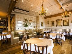 an empty restaurant with tables and chairs