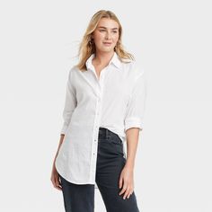 Warm-weather work days or weekend coffee dates, this Tunic Long-Sleeve Collared Button-Down Shirt from Universal Thread™ has you covered in refined style. The woven voile shirt is made of lightweight cotton with a collared neckline, full button placket and shirttail hem to elevate your comfort and style game. Designed in a solid color, the long-sleeve shirt has buttoned cuffs, a back yoke and a tunic-length silhouette for creating versatile tucked-in or untucked ensembles with a variety of botto Classic Shirt With Roll-up Sleeves For Day Out, Everyday Collared Shirt With Roll-up Sleeves, Everyday Button-up Shirt With Rolled Sleeves, Everyday Shirt With Roll-up Sleeves, Everyday Solid Shirt With Roll-up Sleeves, Solid Shirt With Button Cuffs For Everyday Wear, Effortless Fall Workwear Shirt, Classic Shirt With Rolled Sleeves For Day Out, Everyday Button-up Shirt With Button Cuffs