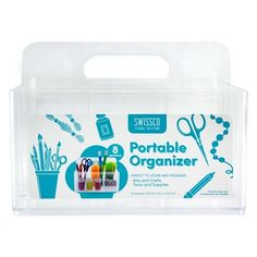 a plastic container with scissors and other items in it