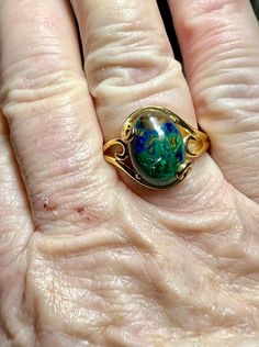 Gemstone: genuine natural oval cabochon cut azurmalachite Size: 14mm x 10mm x 7mm Weight: 8.58cts approximately  Metal: .925 stamped Sterling Silver, 18kt yellow gold plated Size: 10 Weight: 5.3g Gold Oval Turquoise Ring Gift, Oval Opal Ring For May Birthstone, Handmade Oval Turquoise Ring For Formal Events, Handmade Oval Turquoise Ring For Formal Occasions, Oval Gold Turquoise Ring Gift, Unique Oval Turquoise Ring For Formal Events, Unique Oval Turquoise Ring For Formal Occasions, Unique Oval Gold Gemstones, Oval Natural Stone Ring For May Birthstone