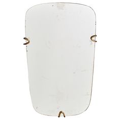 an old white mirror with brass handles on a white background, it appears to be from the early 20th century