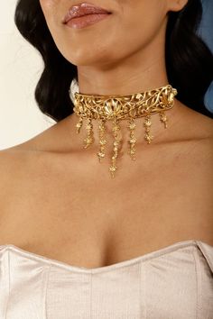 A Unique Vintage Filigree Choker perfectly suited for special occasions and someone that loves statement jewelry. The antique gold finish makes it a bold yet elegant necklace option. It's easy to style with traditional Indian or Pakistani suits, fusion outfits or even with a black dress. The choker necklace is versatile and easy to style. Wear it solo or pair it with matching lotus studs as a set. To complete the look and make it a set by adding a matching earrings, handpiece and bracelet from t Luxury Bollywood Style Necklaces As Gift, Luxury Ornate Jewelry For Diwali, Luxury Yellow Gold Choker For Formal Occasions, Luxury Elegant Necklaces For Diwali, Brass Jewelry With Intricate Design For Parties, Party Jewelry With Intricate Brass Design, Ornate Choker Necklace With Intricate Design, Ornate Choker Necklace For Wedding, Elegant Metal Temple Necklace For Festivals