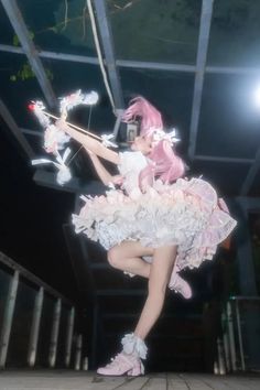 a woman dressed in pink and white is dancing