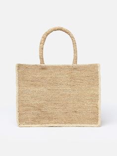 Introducing the Colette Raffia Handbag, a stunning accessory that captures the essence of natural beauty. Crafted entirely from authentic raffia, this handbag exudes a rustic charm and eco-friendly appeal. The Colette Raffia Handbag boasts a unique texture and intricate detailing, showcasing the natural fibers of the raffia material. Its design is characterized by a harmonious blend of earthy tones and a laid-back yet elegant aesthetic. The spacious interior of the handbag makes it perfect for carrying your daily essentials with ease. The durable and lightweight nature of the raffia material ensures both functionality and style, making it an ideal choice for various occasions. Embrace the beauty of nature with the Colette Raffia Handbag, where the authenticity of natural raffia meets a con Luxury Handwoven Natural Bags, Luxury Natural Handwoven Bags, Luxury Handmade Natural Shoulder Bag, Luxury Rectangular Straw Bags, Luxury Straw Shoulder Bag In Rectangular Shape, Luxury Rectangular Straw Shoulder Bag, Luxury Handwoven Rectangular Shoulder Bag, Luxury Handwoven Straw Shoulder Bag, Luxury Natural Shoulder Bag With Braided Handles