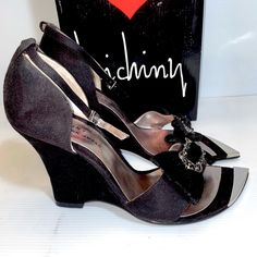 Luichiny Alice Chrome Tip Open Toe Wedge All Manmade Materials Size 9 Brand New Never Worn Heel Approximately 4” Excellent Condition Cute Vintage Bows W/ Cute Vintage Looking Buckles Black Platform Wedge Sandals For Evening, Elegant Ankle Strap Wedge Sandals For Night Out, Fitted Synthetic Wedge Sandals, Black Ankle Strap Wedge Sandals For Party, Elegant Wedge Sandals With Round Toe, Chic Synthetic Wedge Sandals For Evening, Chic Evening Wedge Sandals In Synthetic, Elegant Black High Heel Wedge Sandals, Chic Black Ankle Strap Wedge Sandals