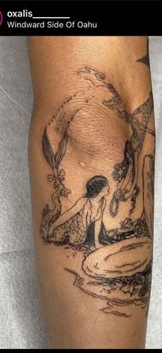 a woman's leg with a tattoo on it