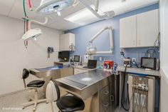 an operating room with medical equipment on the counter and in the ceiling lights above it