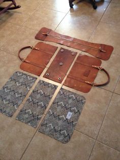 four pieces of leather laid out on the floor