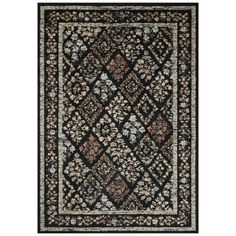 a black rug with floral designs on it