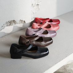 These elegant and sweet Mary Jane shoes are crafted from genuine leather, featuring a chic square-toe design that embodies the essence of French vintage style. Available in five captivating colors: classic black, vibrant red, understated brown, sweet pink, and unique purple. Each color is carefully selected to perfectly complement a variety of styles and occasions. The graceful silhouette, combined with smooth lines and a strap design, adds a touch of vintage charm and sweetness, while providing extra support to ensure a secure fit and enhanced comfort. The leather undergoes a washing and air-drying process, creating natural wrinkles that give the shoes their distinctive appearance. These shoes are crafted using Goodyear welt construction and inside-out stitching techniques, involving over Red Mary Jane Shoes, Womens Mary Janes, Stitching Techniques, Mary Jane Flats, Jane Shoes, Goodyear Welt, Strap Design, Smooth Lines, Mary Jane Shoes