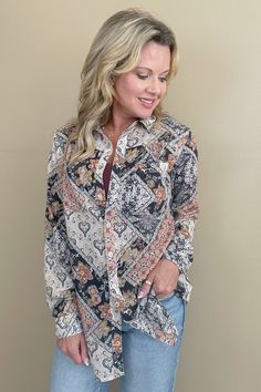 Introducing our Fall Essential Paisley Printed Crepe Blouse, featuring a cream, black, and rust paisley print on a luxurious crepe fabric. Perfect for any occasion, this blouse boasts a button down front, convenient front pockets, and a relaxed fit that guarantees both comfort and style. Elevate your wardrobe with this versatile and chic piece! -Fits true to size -Model 5'3" wearing size small -Fabric: 100% Polyester -Season: Autumn Athletic Dresses, Fall Essentials, Denim Gift, Crepe Fabric, Romper Dress, Vest Dress, Paisley Print, Jeans Dress, Skirts For Sale