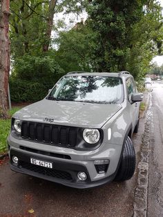 the jeep is parked on the side of the road