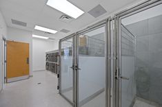 an empty room with glass partitions in it