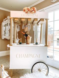 the champagne cart is set up in front of the window for people to see it