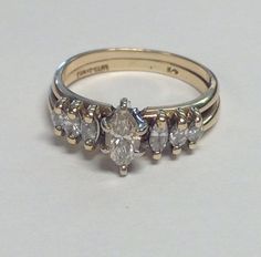 a diamond ring with five stones on it