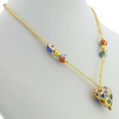 Every woman loves to own unique handcrafted jewelry. This Murano necklace in rich gold and millefiori palette is every woman's dream, rich and beautiful like Venice itself. The authentic Murano necklace features an exquisite 24K gold-layered heart pendant suspended from an elegant gold-lined beaded necklace accented with gorgeous 24K gold-lined and millefiori Murano glass beads. Enjoy this unique Murano Necklace and the aura of Venetian romance and elegance that it projects. Measurements: The he Gold Necklaces With Heart Beads For Jewelry Making, Elegant Multicolor Heart Beads Necklace, Gold Murano Glass Jewelry As Gift, Gold Murano Glass Jewelry For Gifts, Gold Murano Glass Jewelry Gift, Elegant Murano Glass Necklaces For Gift, Elegant Murano Glass Necklace For Gift, Elegant Multicolor Heart Necklace For Gift, Elegant Multicolor Heart Necklace Gift