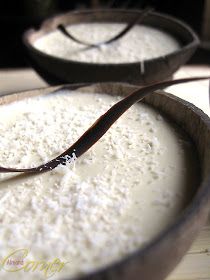 two bowls filled with white powder on top of a table