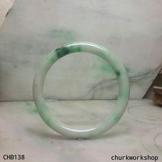 White base with splotches green jade bangle•Dimensions: 54 mm inner •Thickness 8 mm •Weight: 31 grams•Color: White base splotches green•Translucency: Opaque•Shape: Round•Code: CHB138 Symbolizes: Good luck, protection, longevity This hand carved jade bangle is guaranteed to be 100% natural, non-enhanced, and untreated. We do our best to keep the photos the same as the item; these photos are not enhanced or edited. Please keep in mind that the color may vary on different monitors. •Should you find Carved Jade, Jade Bangle, Jade Carving, Christian Jewelry, Jade Jewelry, Green Jade, Hair Sticks, Trendy Jewelry, Jade Green