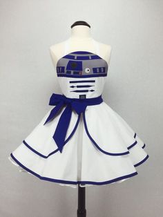 a white dress with blue trims and a star wars character on the front is shown