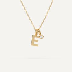 A personalized initial chain design featuring a letter E necklace pendant. This beautiful women's letter necklace is approx. 1cm tall and comes in solid 14k white or yellow gold with an optional 0.05 carat (3mm) diamond and an adjustable 16 inch - 18 inch chain. E Pendant Necklace, E Initial Necklace, Letter E Necklace, Letter K Necklace, E Necklace, Xoxo Jewelry, K Necklace, J Necklace, M Necklace