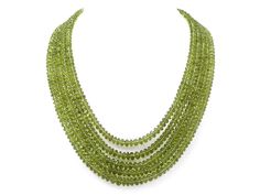 An 18K white gold multi-strand peridot bead necklace set with an elongated cabochon ruby and pavé diamond clasp. Metal: 18K White Gold Gemstone: Peridot: 985 carats Gemstone: Ruby: 10.58 carats Gemstone: Diamonds: 0.26 carats Design Era: Contemporary Cabochon Ruby, Woman Jewelry, Ruby Necklace, Jewelry Unique, Knot Necklace, Multi Strand, Bead Necklace, Pave Diamonds, Gemstone Necklace