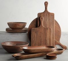 wooden bowls, cutting boards and chopsticks are on display