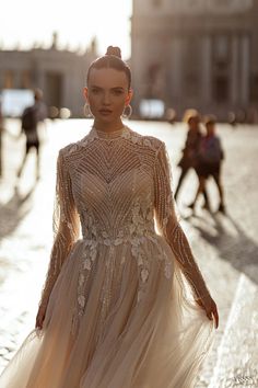 a woman in a dress is walking down the street