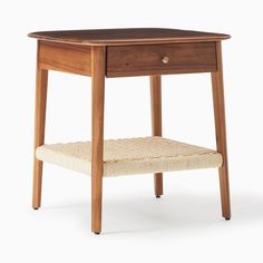 a small wooden table with a drawer on the bottom and a cushion underneath it, against a white background