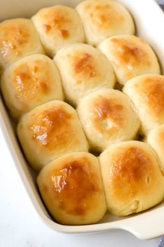 a casserole dish filled with bread rolls