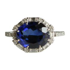 an oval blue sapphire and diamond ring